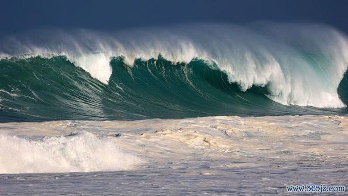 Residents watch the waves during a breaking swell in Saint-Leu, in the south of the French island of Reunion, Indian Ocean, on June 29, 2022, after a wave-submergence alert was declared. (Photo by Richard BOUHET / AFP) (Photo by RICHARD BOUHET/AFP via Getty Images)